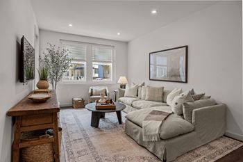 a living room with a couch and a tableat Westbury Apartments, Rancho Cucamonga, CA, 91739