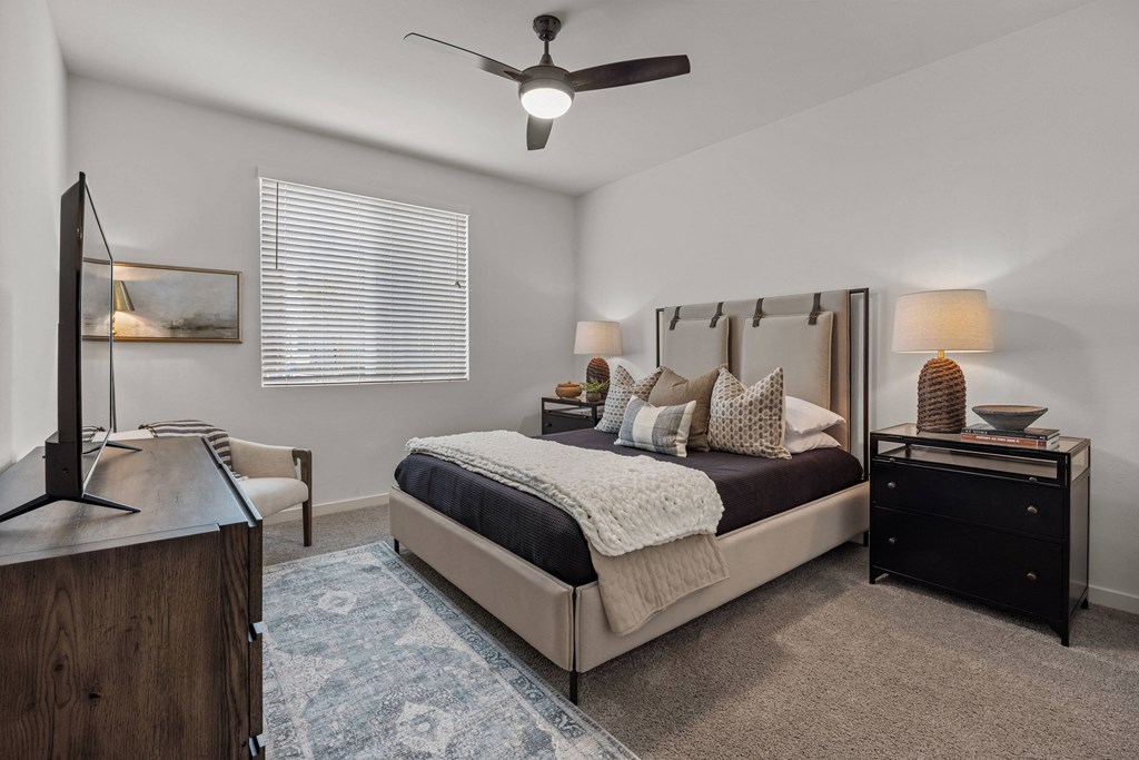 a bedroom with a bed and a ceiling fanat Westbury Apartments, Rancho Cucamonga, California