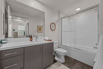 a bathroom with a shower and a sink and a toiletat Westbury Apartments, Rancho Cucamonga