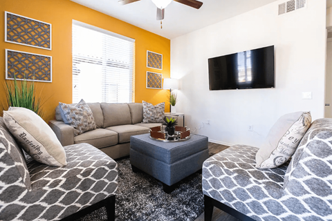 a living room with a couch and a tv