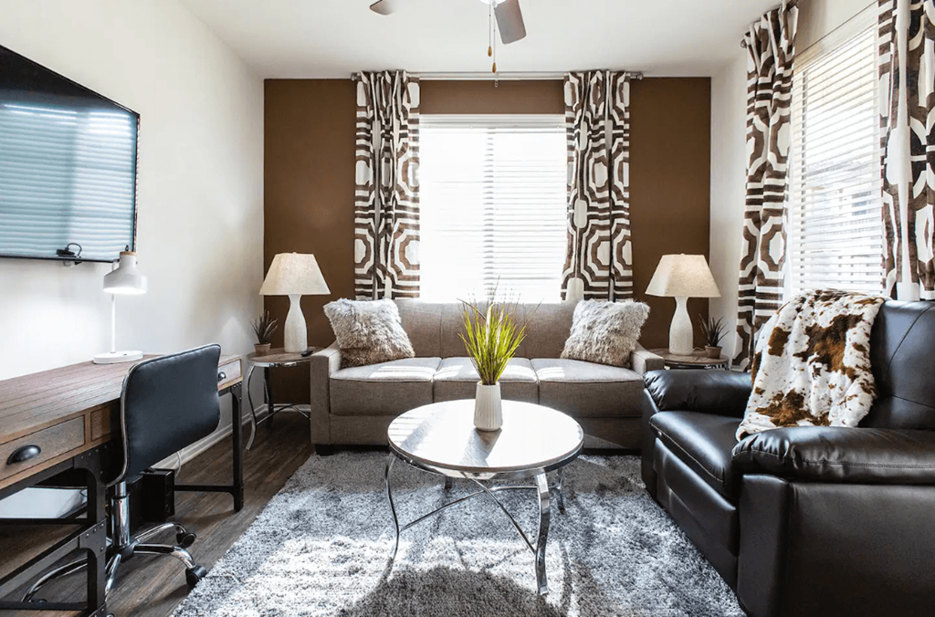 a living room with a couch and a table