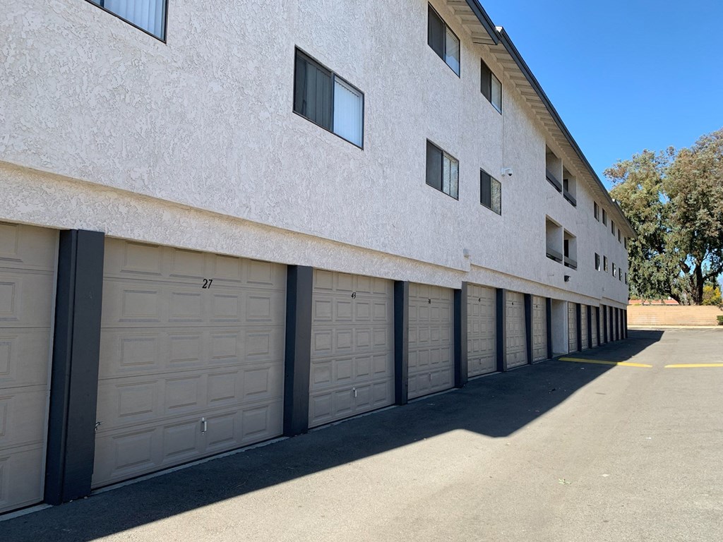 a row of garage doors on the side of a building