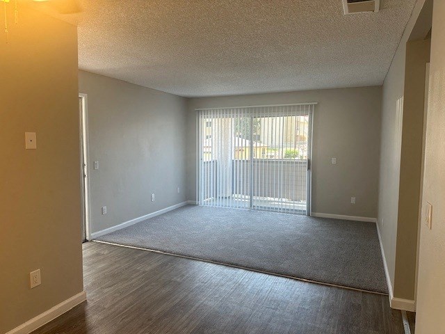 Upstairs unit with Carpet in the living roomat Lincoln Park Apartments, Corona, CA