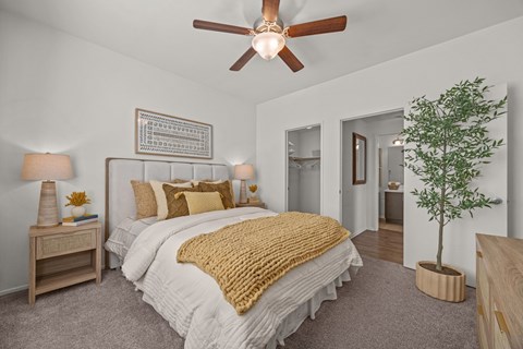 Master bedroom with walk-in closet and ensuite bathroom at Paloma Apartment Homes, California, 91761