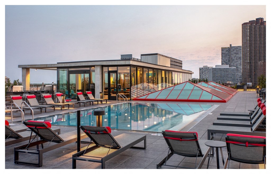 the pool on the roof of the envoy hotel at sunset