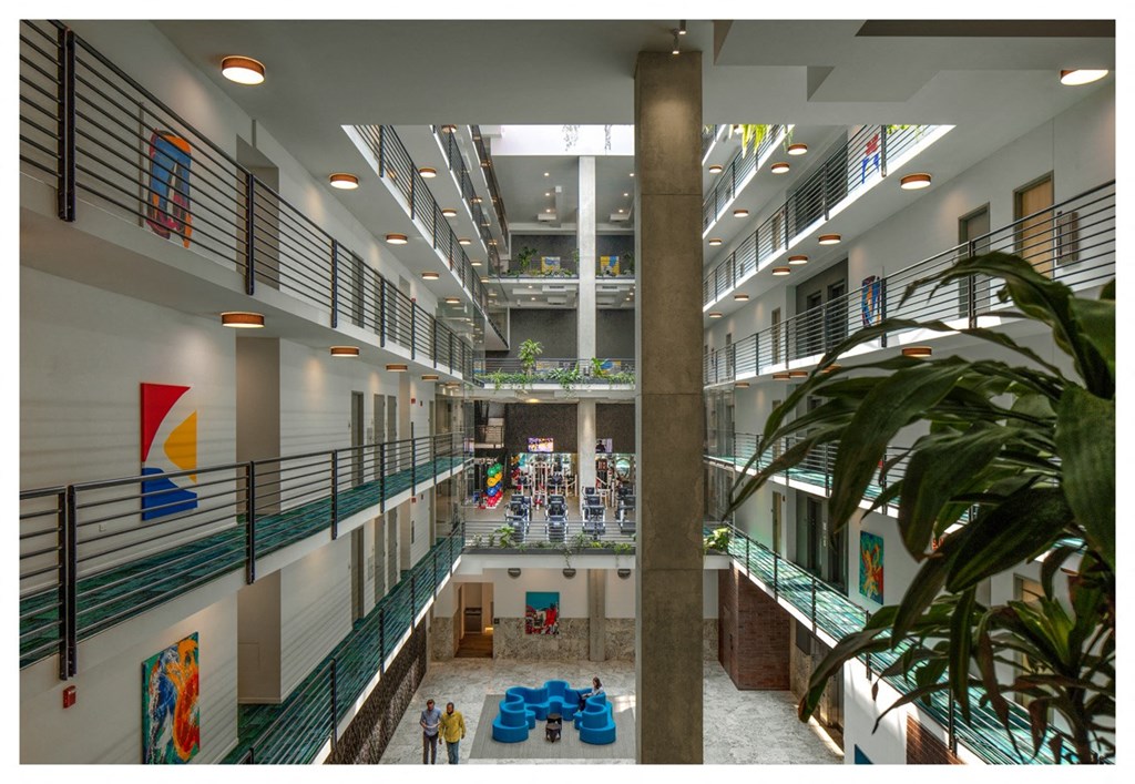 a view of the interior of a large building with a large lobby and a staircase
