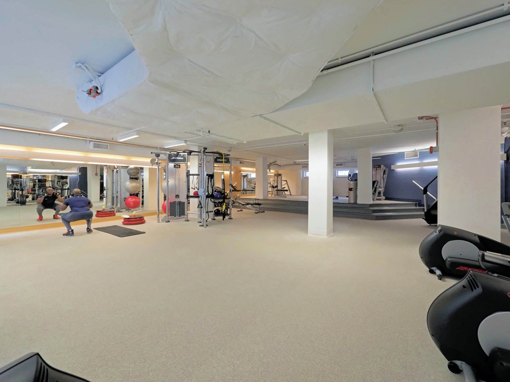 a view of the gym from the treadmill area in the fitness center at the village