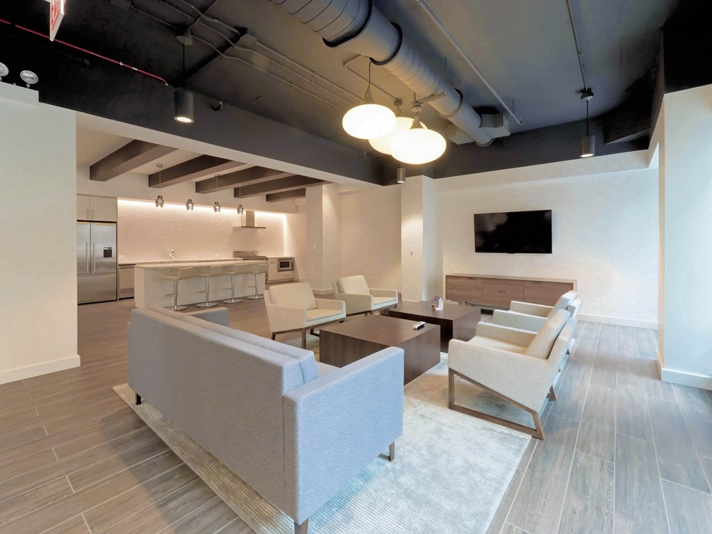 a living room with couches and chairs and a table