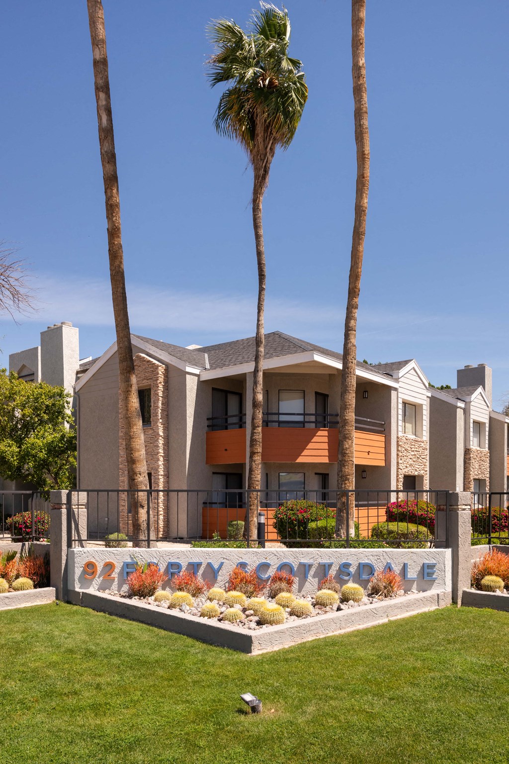 a building with palm trees in front of it
