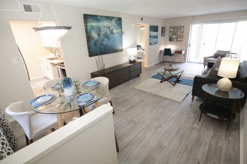 a view of a living room and dining room from the kitchen