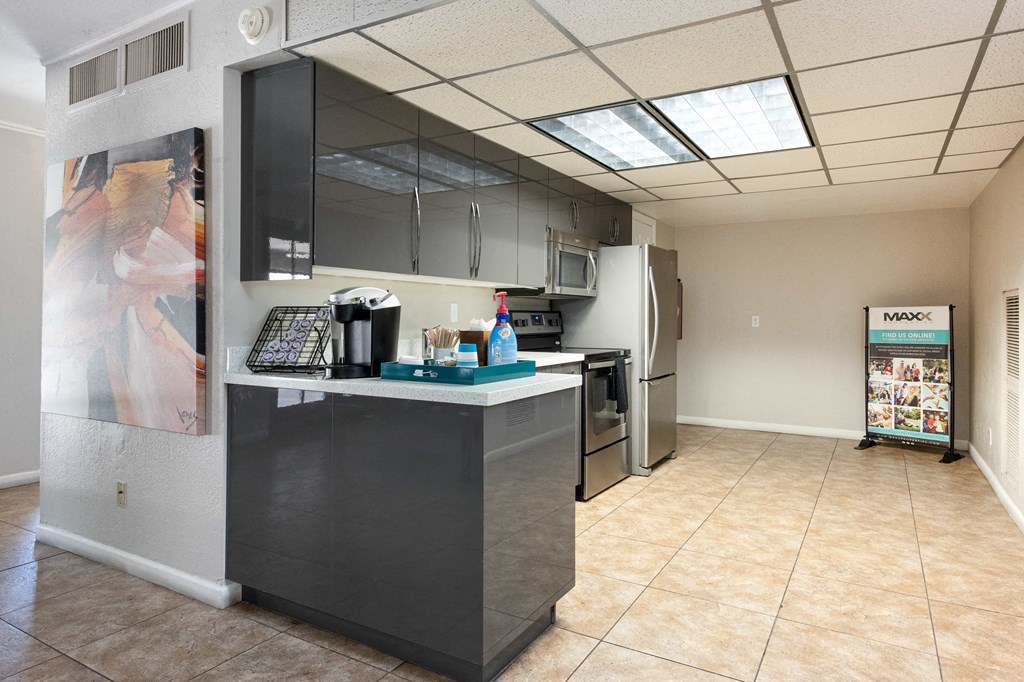 a kitchen with a counter and a refrigerator
