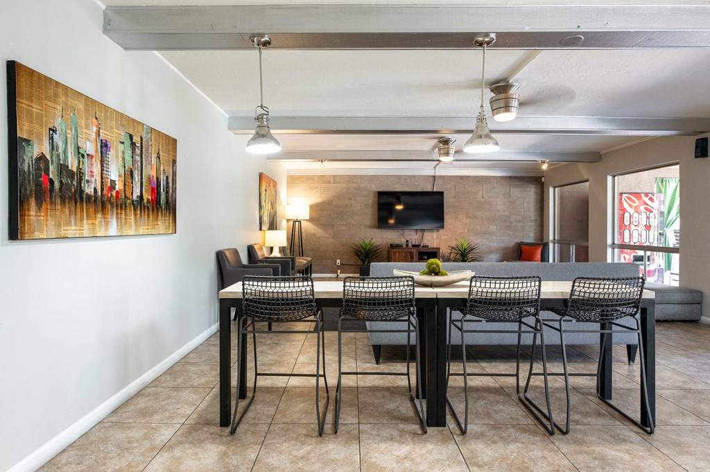 a dining room with a table and chairs