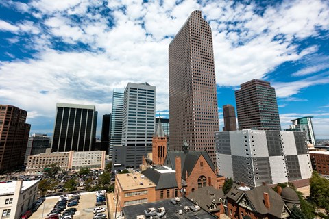 an aerial view of the city with tall buildings and skyscrapers