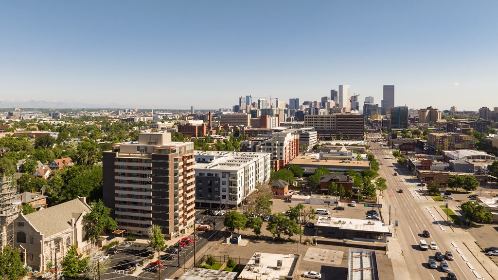 A cityscape with a clear blue sky above.