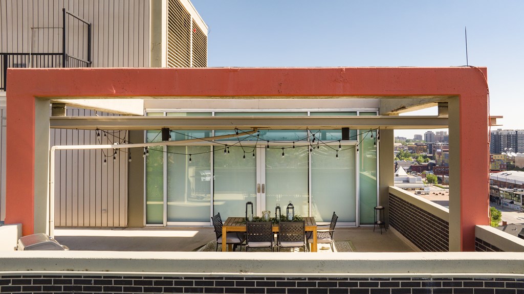 A modern building with a red and white exterior and a glass wall.