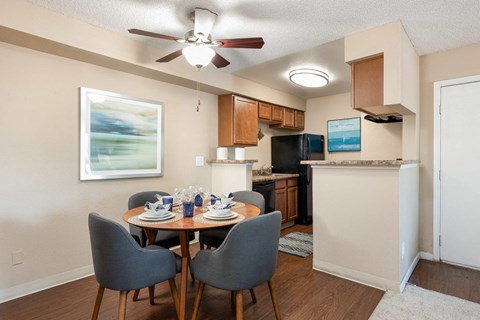 an open kitchen and dining room with a table and chairs