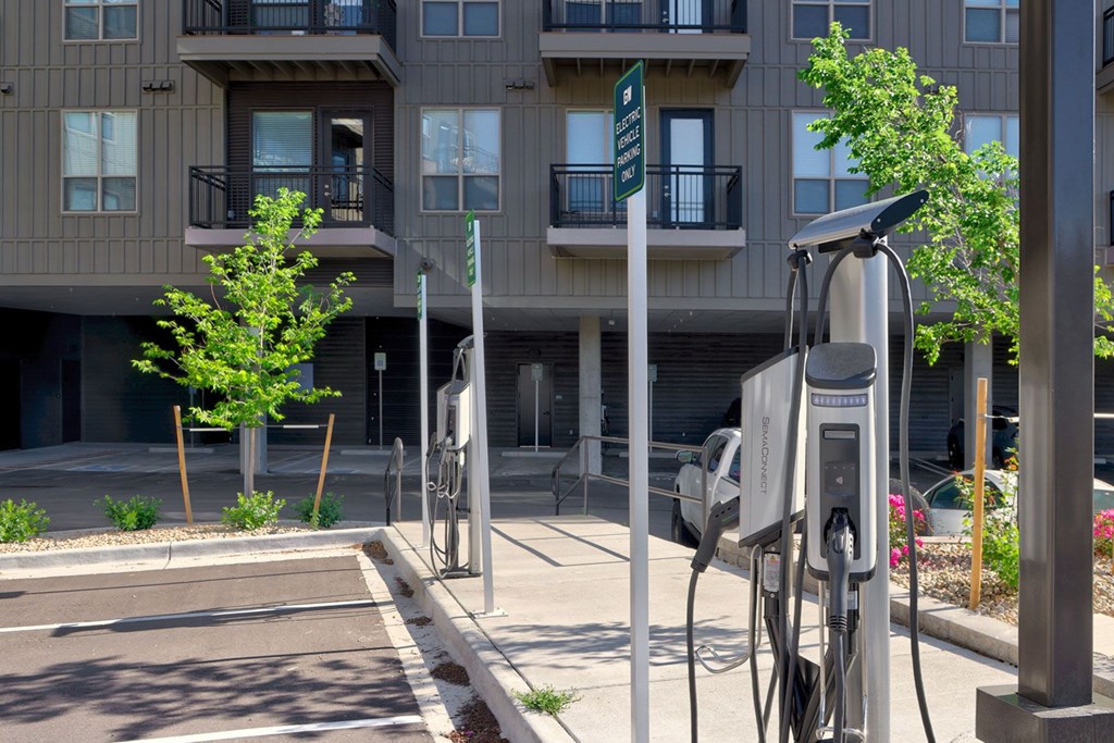 A charging station for electric vehicles is located outside a building.