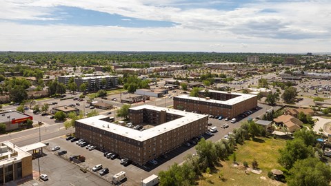 an aerial view of a city with buildings and cars