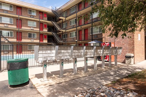 a bench in front of an apartment building