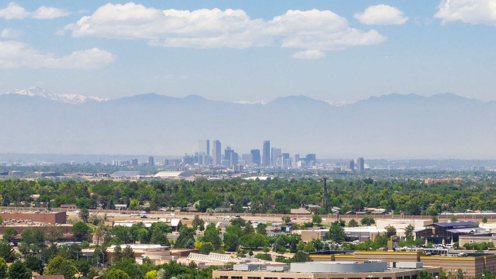 the city with the mountains in the background