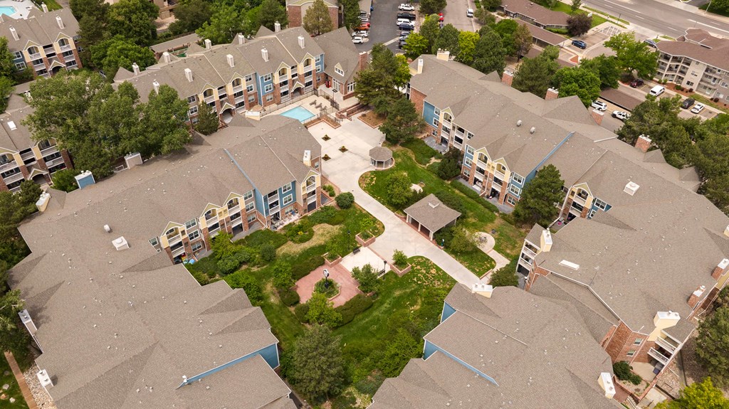 an aerial view of houses in a neighborhood with trees