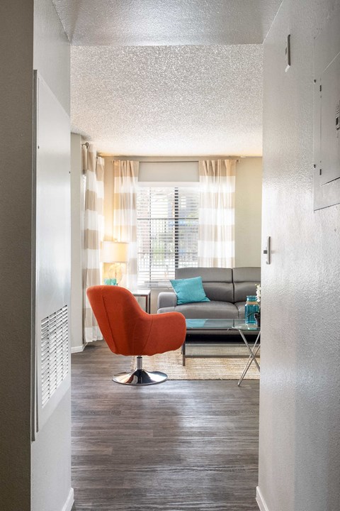 a living room with a couch and a chair