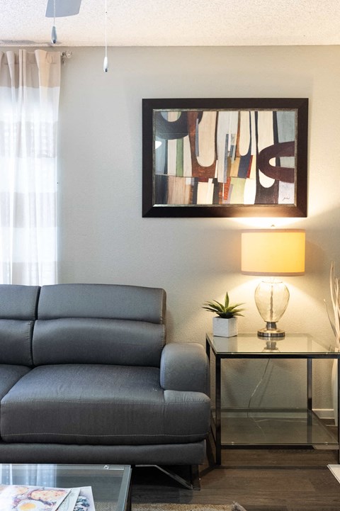 a living room with a couch and a table