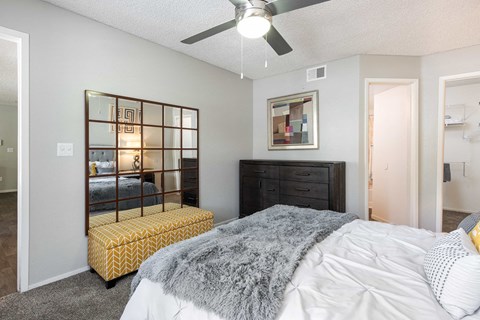 our apartments offer a bedroom with a bed and a mirror