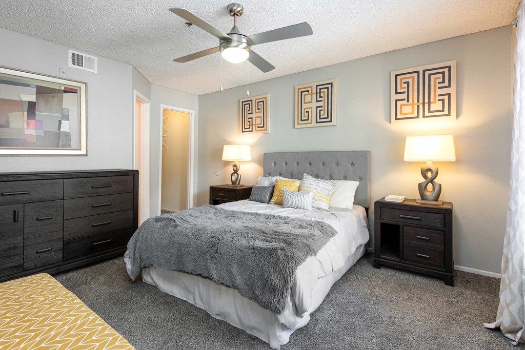 the preserve at ballantyne commons bedroom with bed and ceiling fan