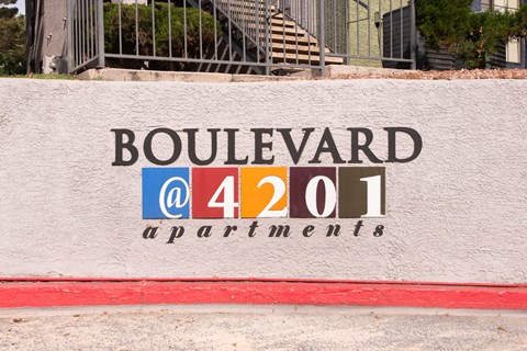 a sign on the side of a building that says boulevard a 441 apartments