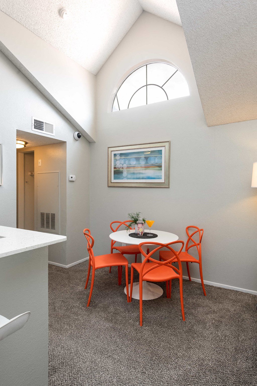 a small dining room with a table and chairs