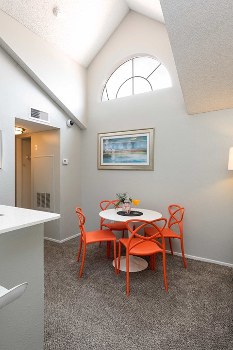 a small dining room with a table and chairs
