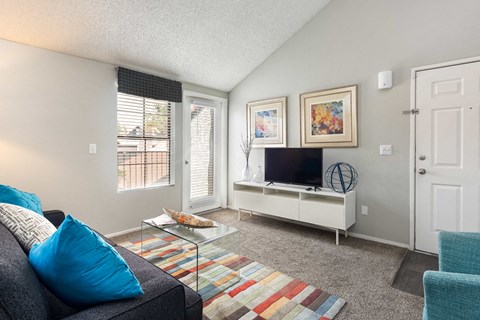 a living room with a couch and a tv