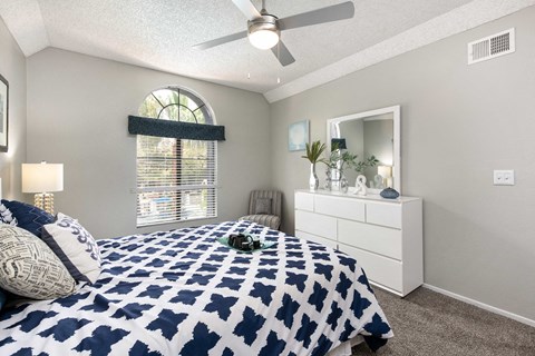 the preserve at ballantyne commons bedroom with bed and ceiling fan