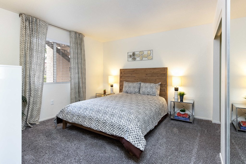 a bedroom with a bed and a window