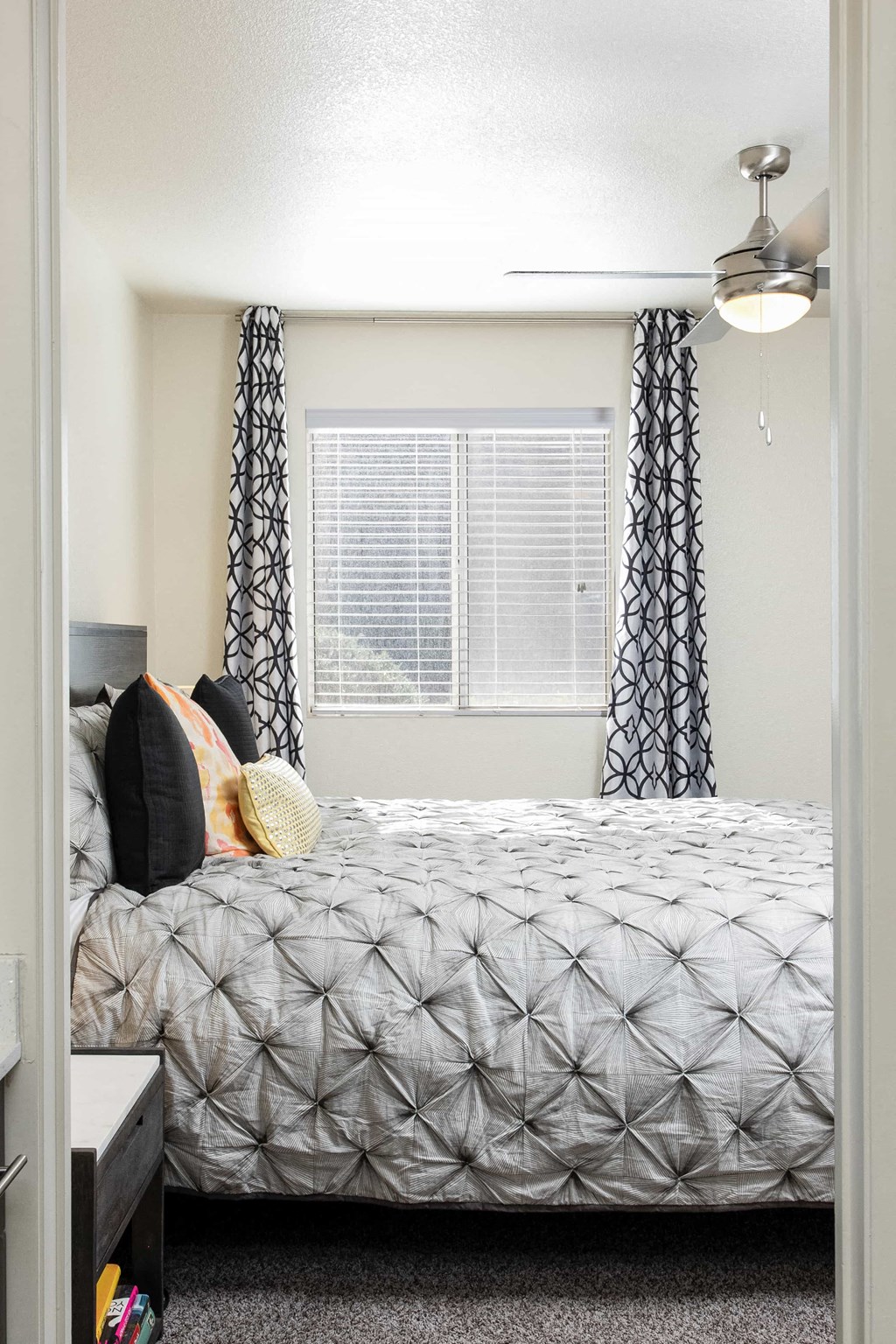 a bedroom with a bed and a window