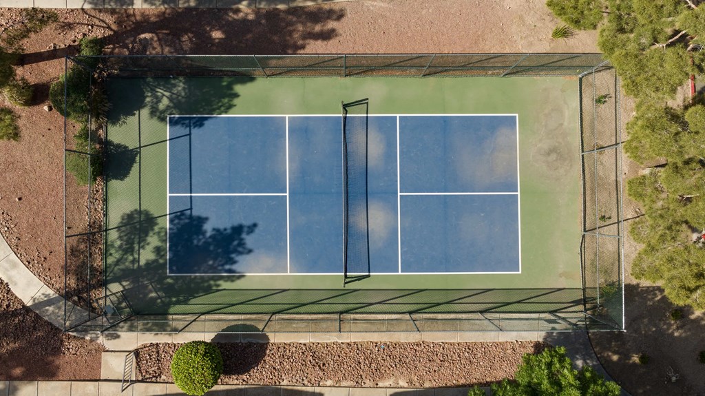 an aerial view of a tennis court on a
