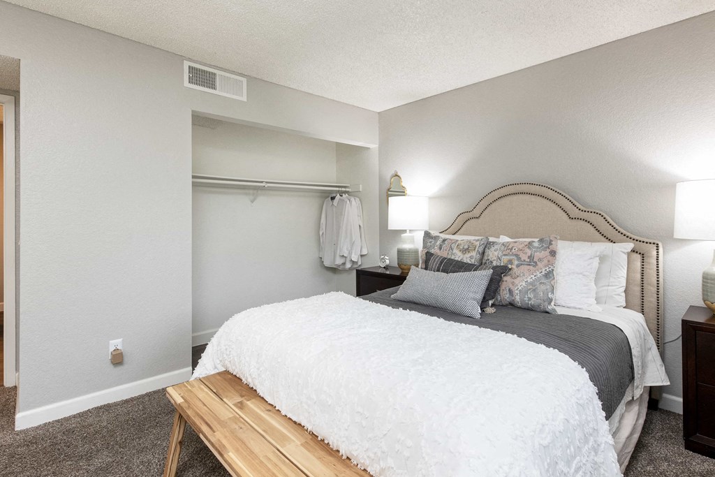 a bedroom with a bed and a dresser