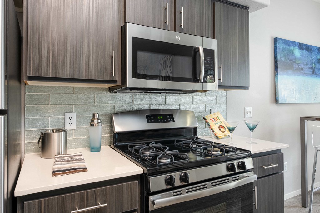 a kitchen with a stove and a microwave