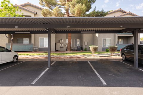 a parking lot with cars parked in front of a building