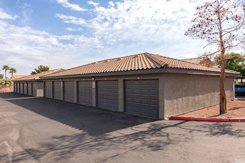 a parking lot with a row of garage doors