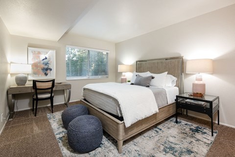 a bedroom with a bed and a round window