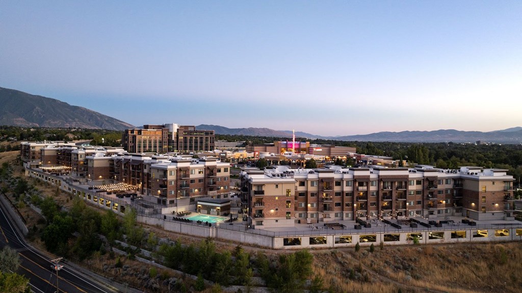 an aerial view of a city with buildings and a train