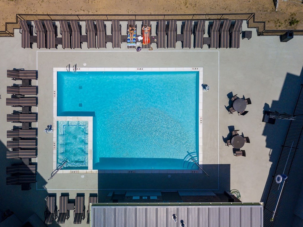 arial view of a swimming pool on the roof of a building
