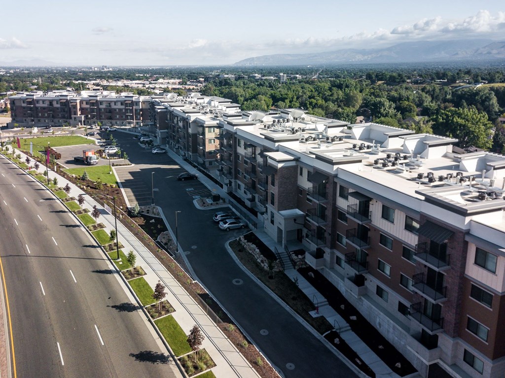 an aerial view of a city with buildings and a road