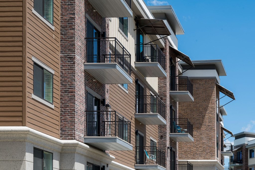 an apartment building with balconies on the side of it