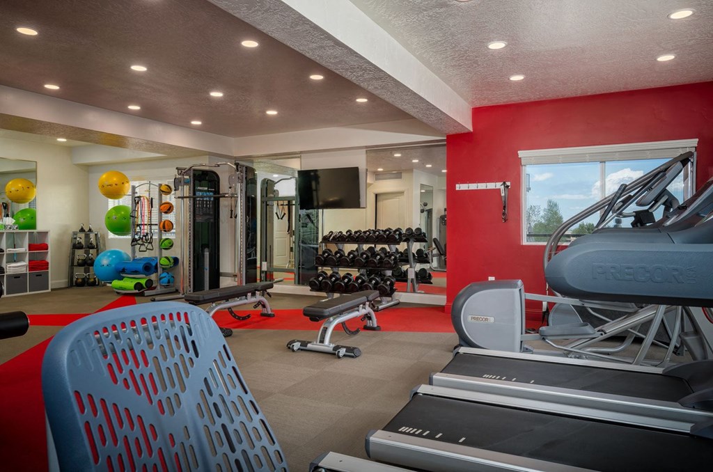 fitness center with exercise equipment
