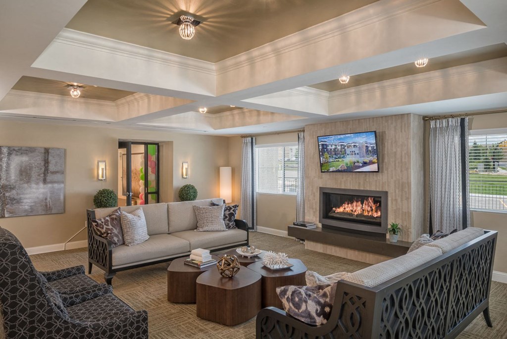 a living room with a couch and a fireplace