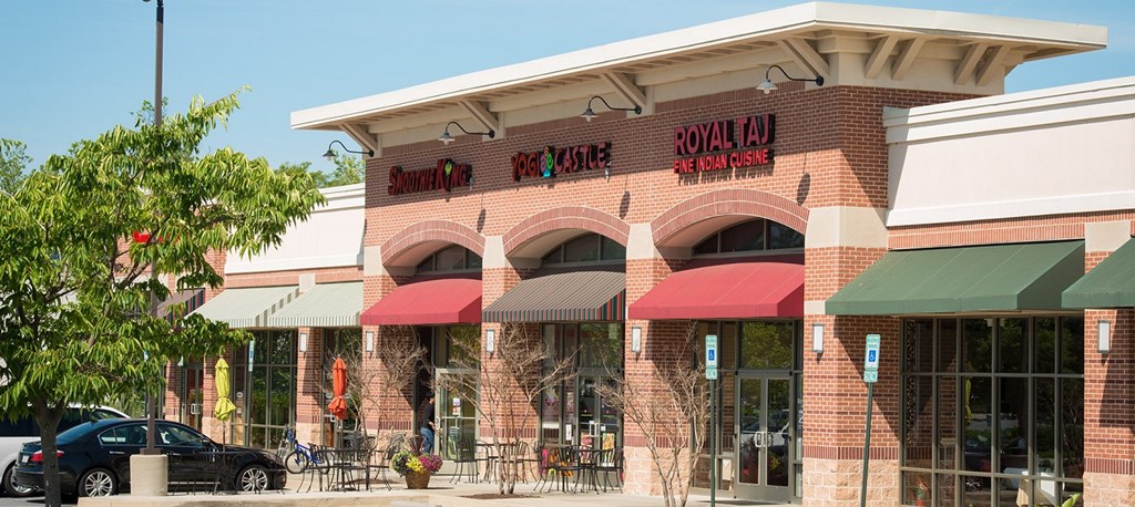 the front of a mall building with red umbrellas building with red umbrellas at The Metropolitan Downtown Columbia, Columbia