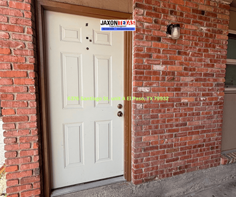 A white door with a sign that says "Jaxon's" above it.